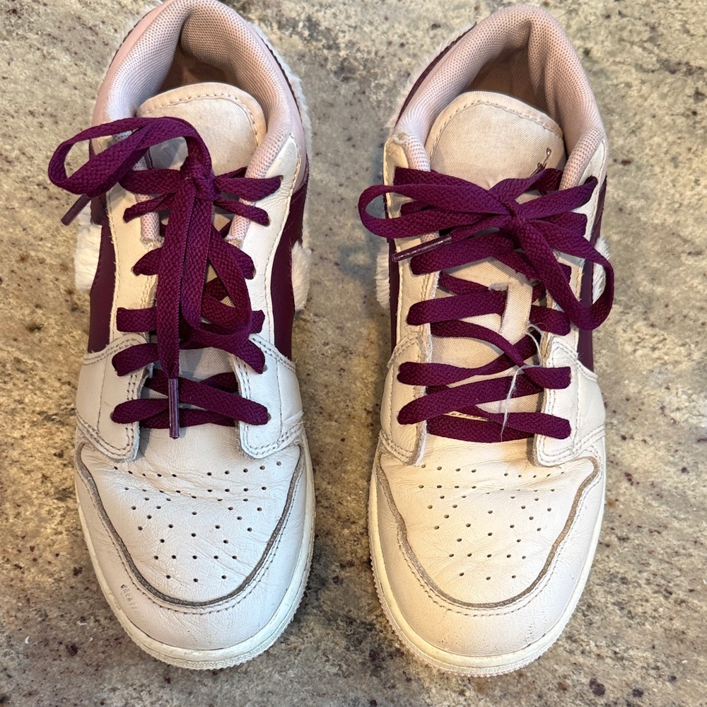 Girls low Jordan’s with furry Nike swoosh